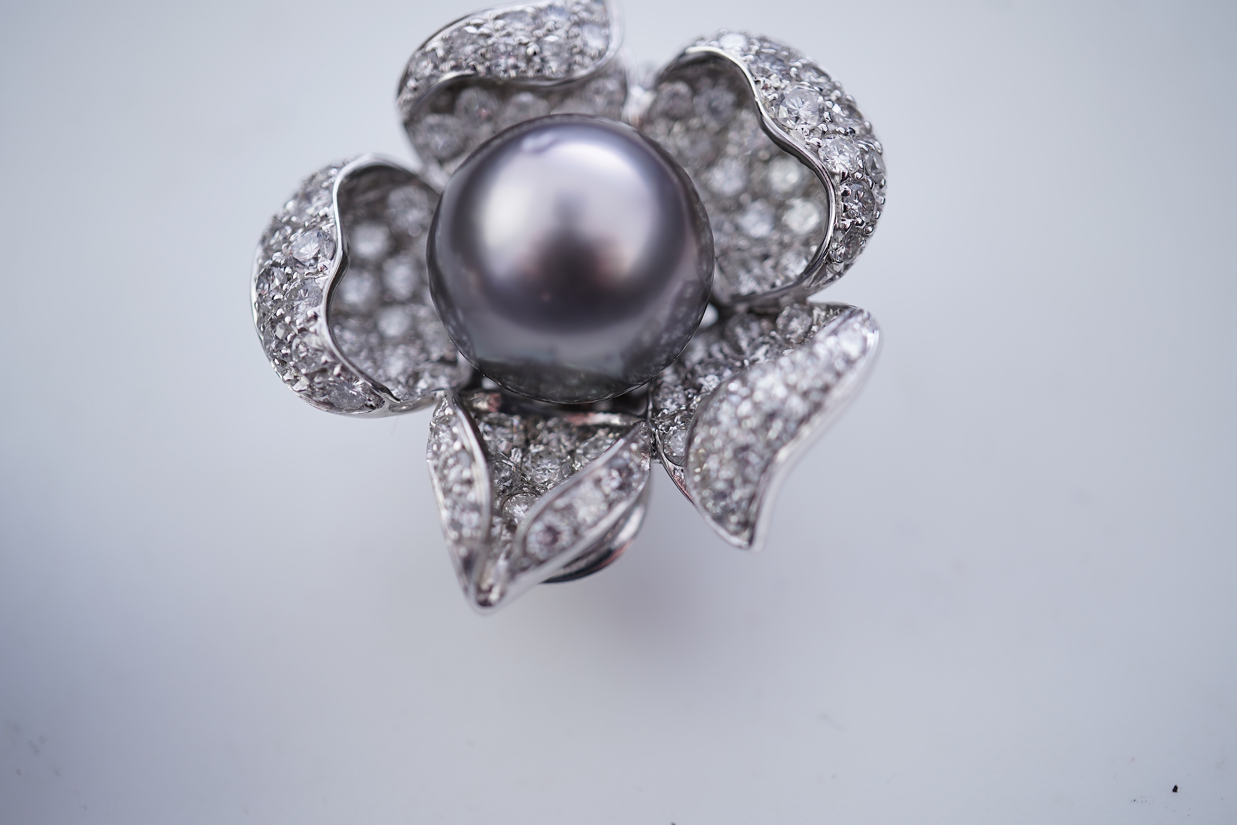 A pair of cultured pearl and diamond ear clips